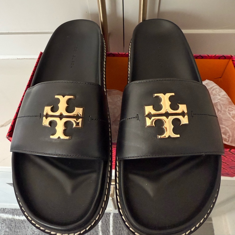 WOMEN’S Black and Gold TORY BURCH SLIDES.